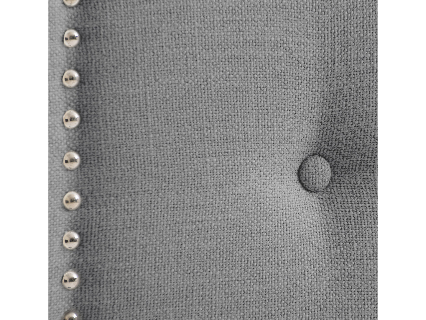 Light grey padded twin headboard with tufted design and soft fabric upholstery.