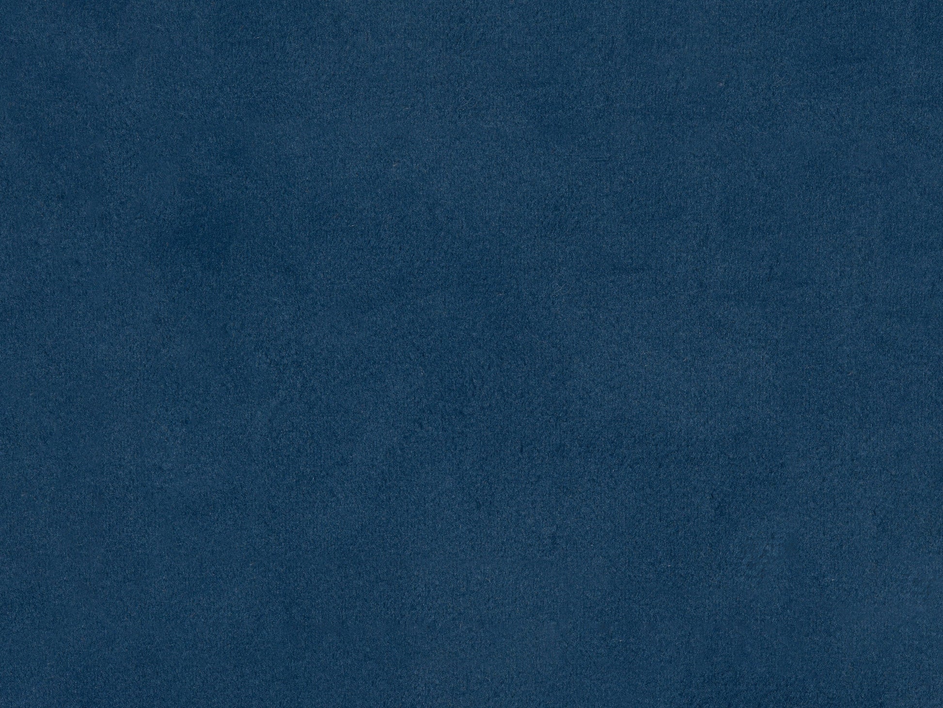 Navy blue velvet queen headboard with tufted design and plush texture.