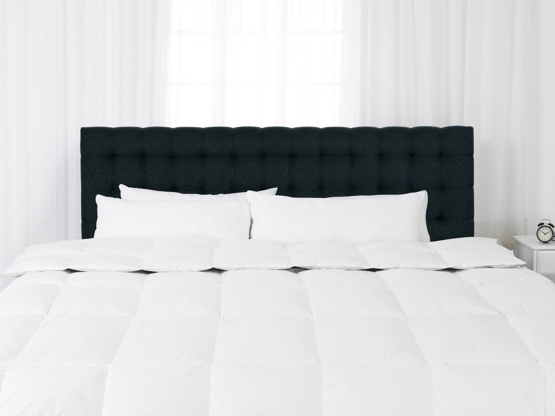 Blue modern king headboard with tufted fabric and minimalist design.