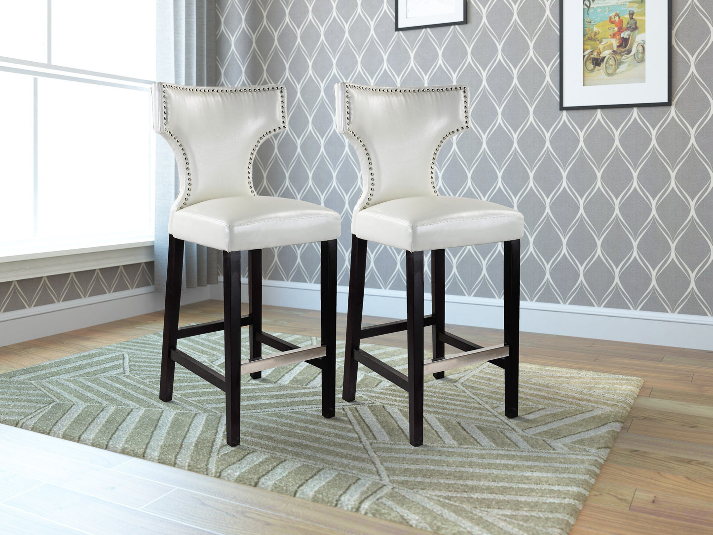 White bar height bar stools set with cushioned seats, sleek metal legs, and modern design.