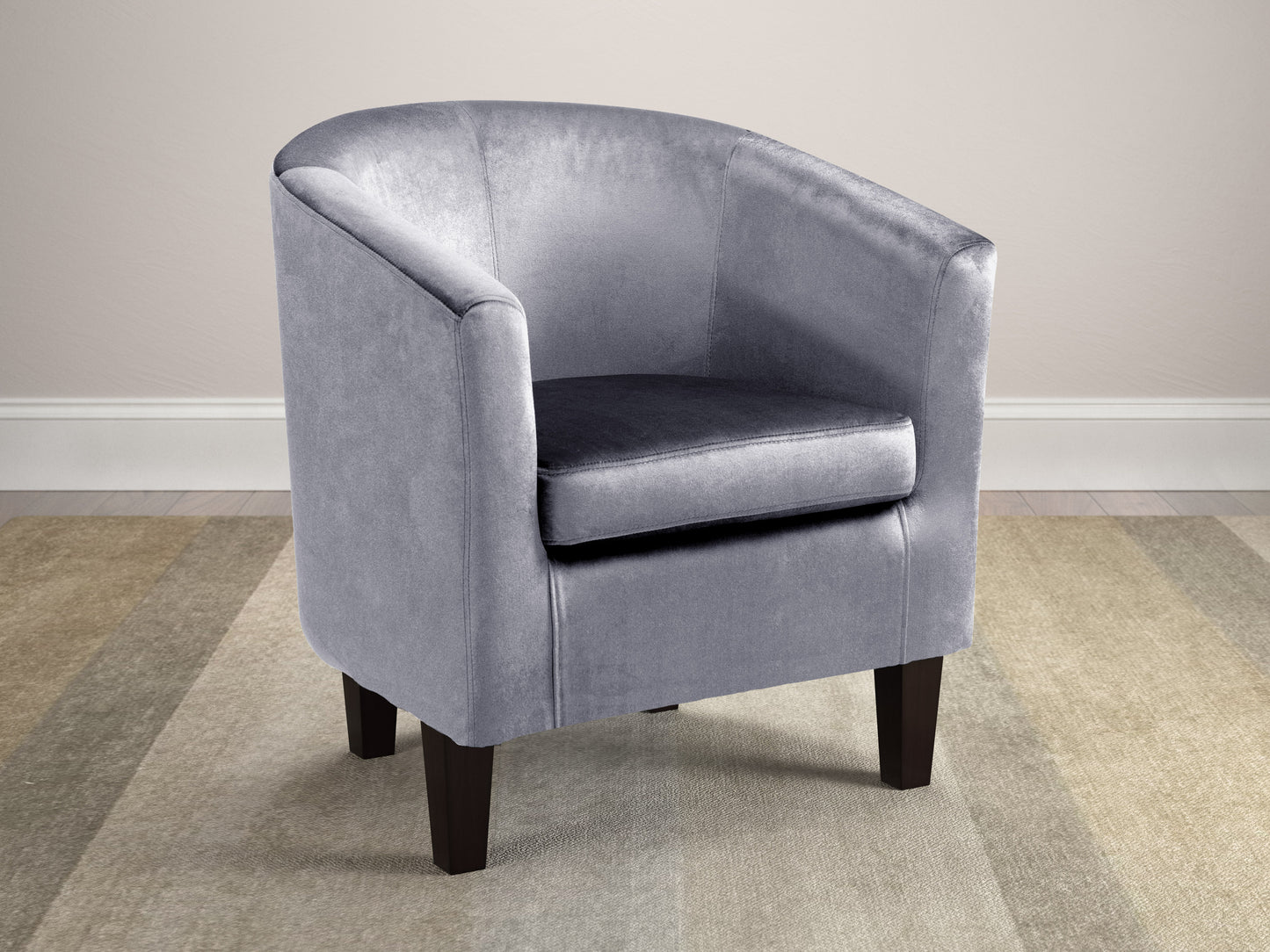 Navy blue velvet barrel chair with gold metal legs, featuring a curved backrest and plush cushioning for a luxurious and modern accent piece.