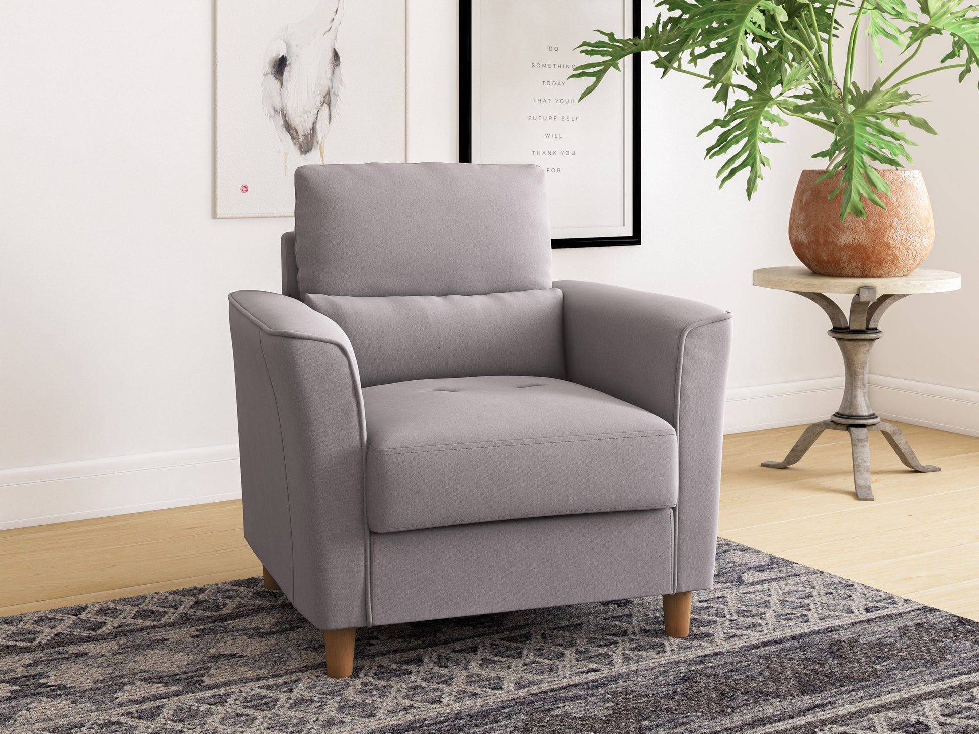 Modern arm chair with sleek black metal frame, soft grey fabric upholstery, and plush cushions. Features minimalist design, comfortable armrests, and sturdy construction, perfect for contemporary living spaces.