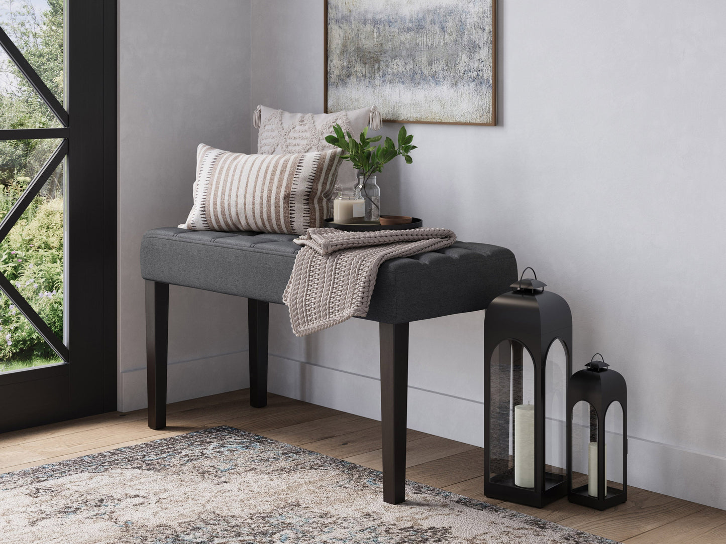 Grey entryway bench with cushioned seat, wooden frame, and modern design.