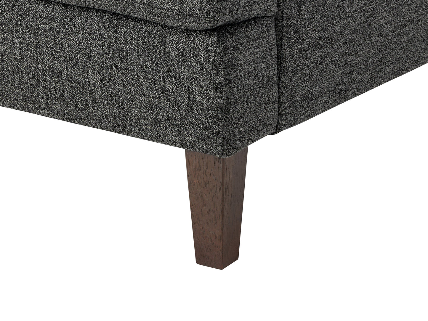 Dark grey mid-century armchair with wooden legs, tufted backrest, and sleek minimalist design.
