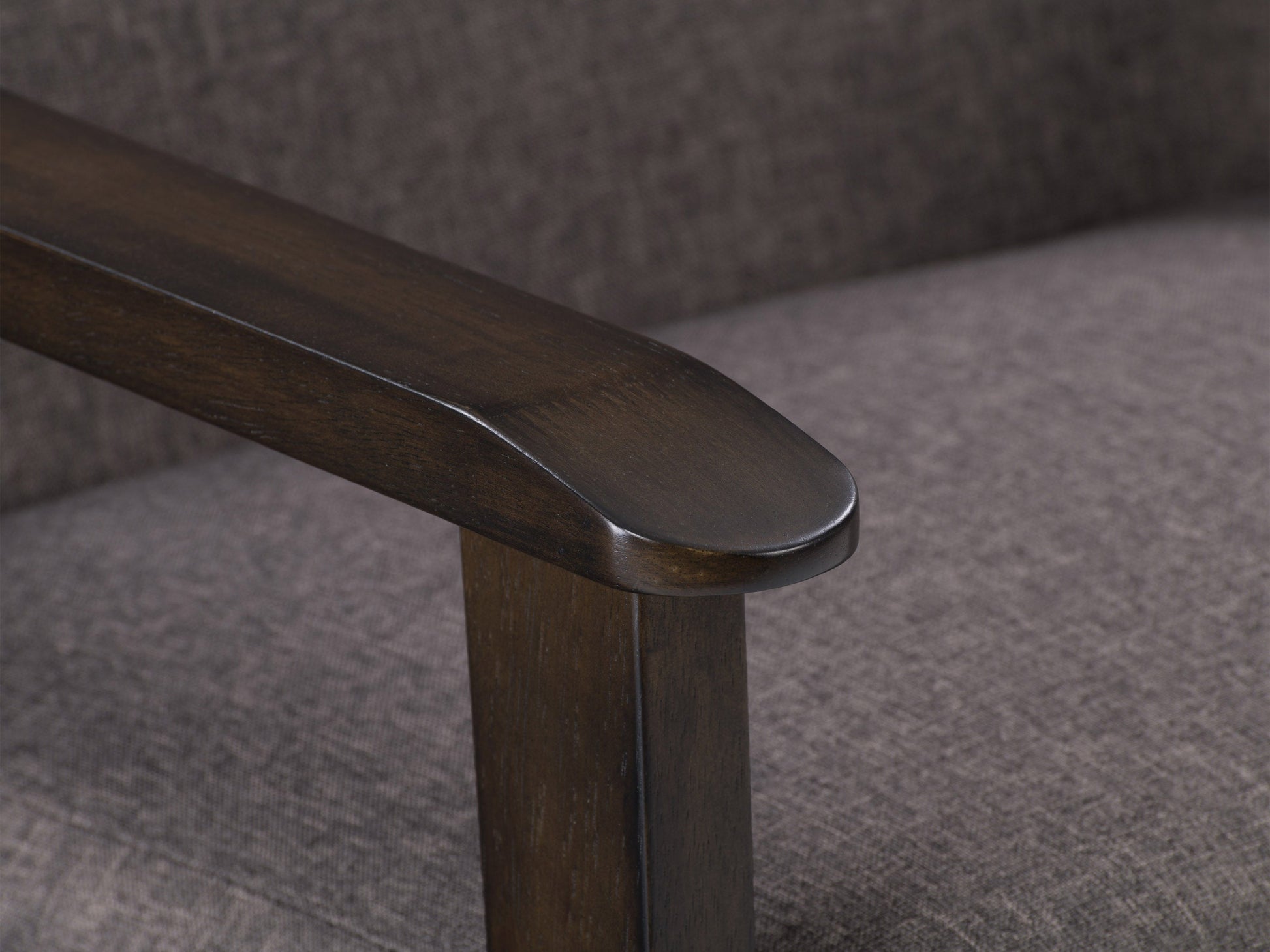Brown wood accent chair with cushioned seat, curved backrest, and minimalist design.