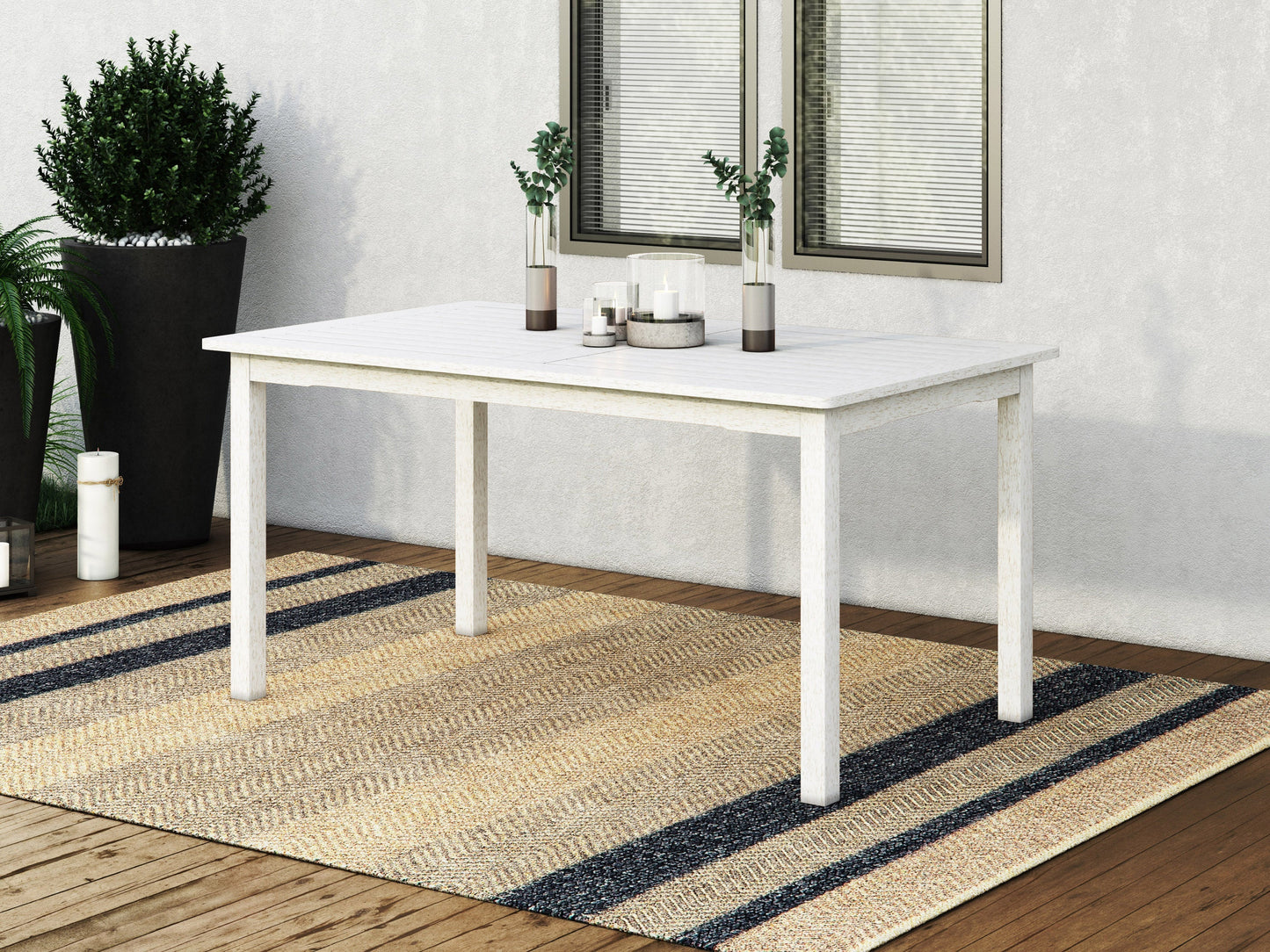 Washed white outdoor wood dining table with slatted top and sturdy legs, perfect for patio or garden settings.