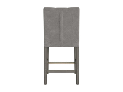 Silver grey fabric counter height bar stool with tufted seat and wooden legs.