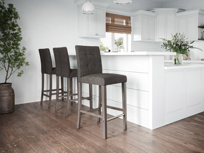 Charcoal brown fabric bar height stool with wooden legs and tufted backrest.