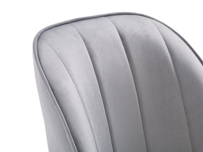 Set of 2 grey velvet dining chairs with tufted backs, sleek black metal legs, and modern design.