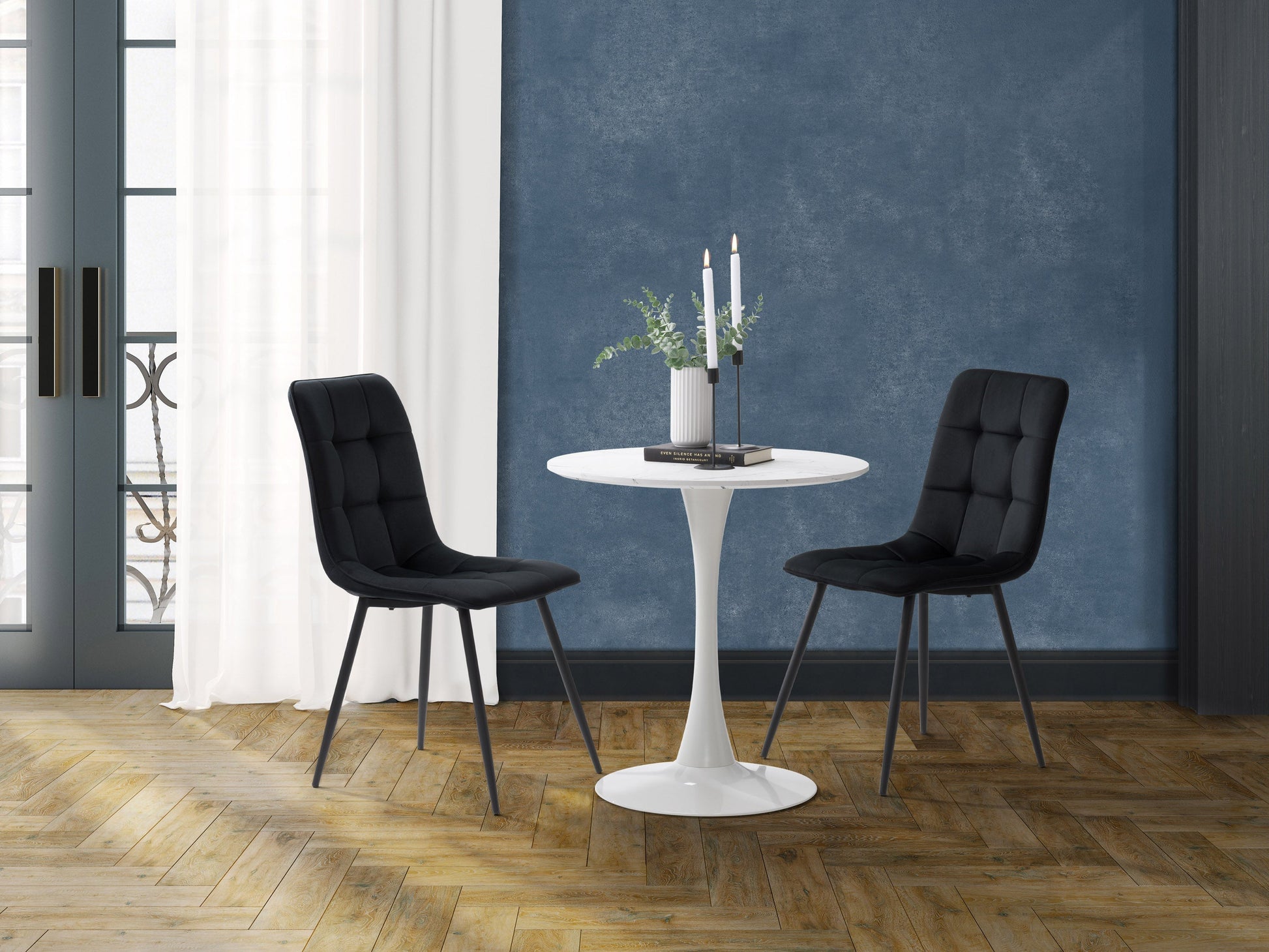 Black 3-piece bistro dining set with round table and two cushioned chairs, sleek metal frame, ideal for small spaces.