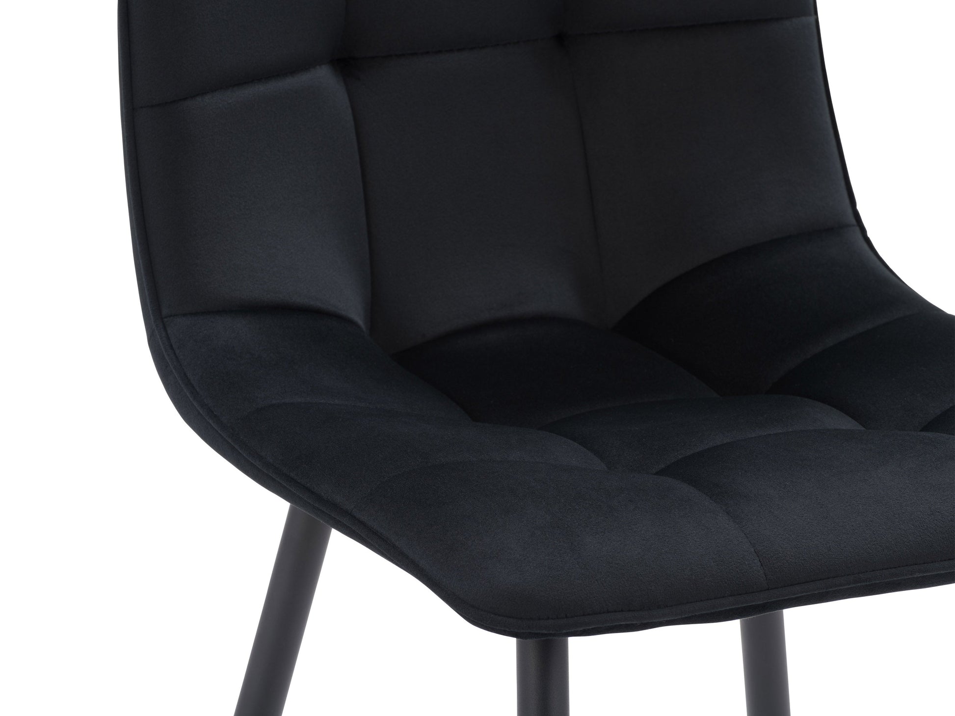 Black round dining table set with four matching chairs, sleek modern design, and sturdy metal legs.