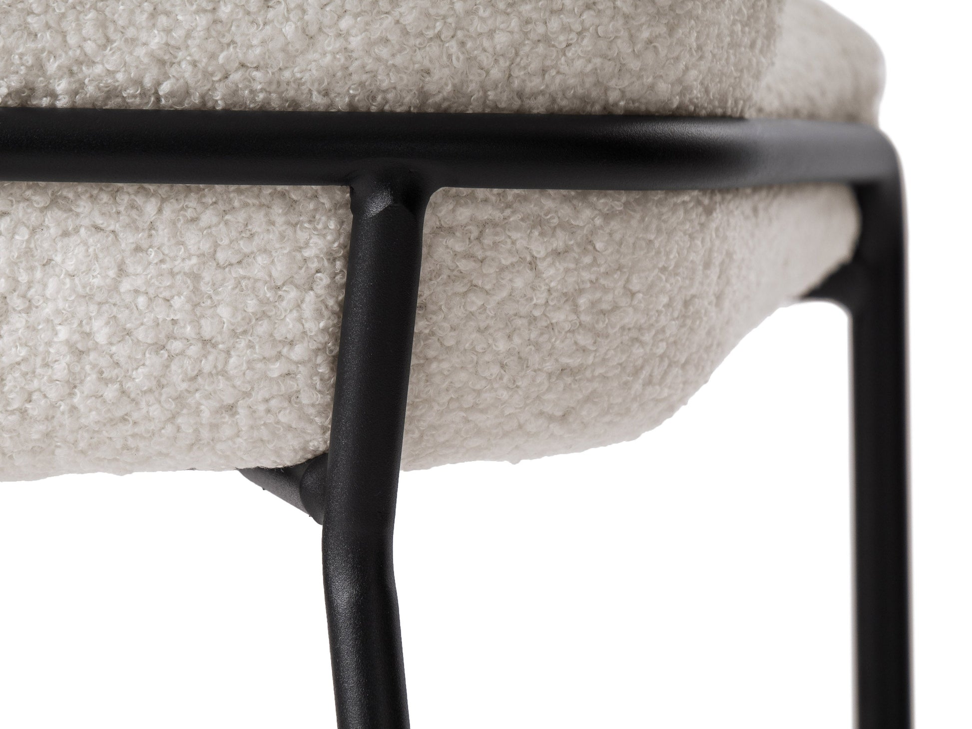 White boucle bar stool with curved backrest, wooden legs, and plush upholstery, perfect for modern kitchen islands.