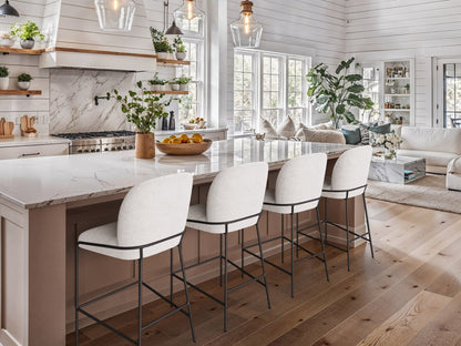 White boucle bar stool with black metal legs, modern design, and plush upholstery.