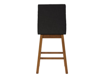 Dark grey channel tufted bar stool with wooden legs and sleek, modern design.