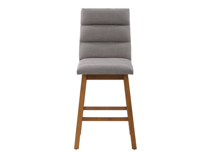Light grey channel tufted bar stool with wooden legs, upholstered seat, and backrest for modern kitchen or bar.