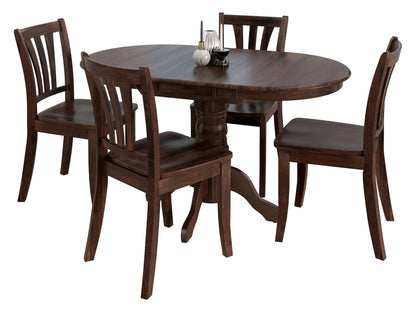 A dark brown round table with four matching chairs and a centerpiece