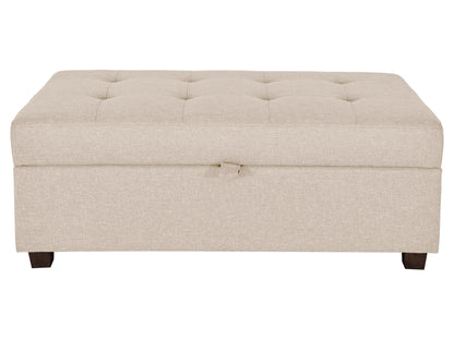Charcoal gray tufted storage ottoman with lid pull tab and wooden legs.