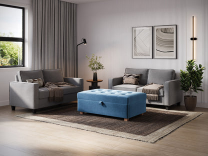 Blue large storage ottoman with tufted fabric, wooden legs, and spacious interior storage.