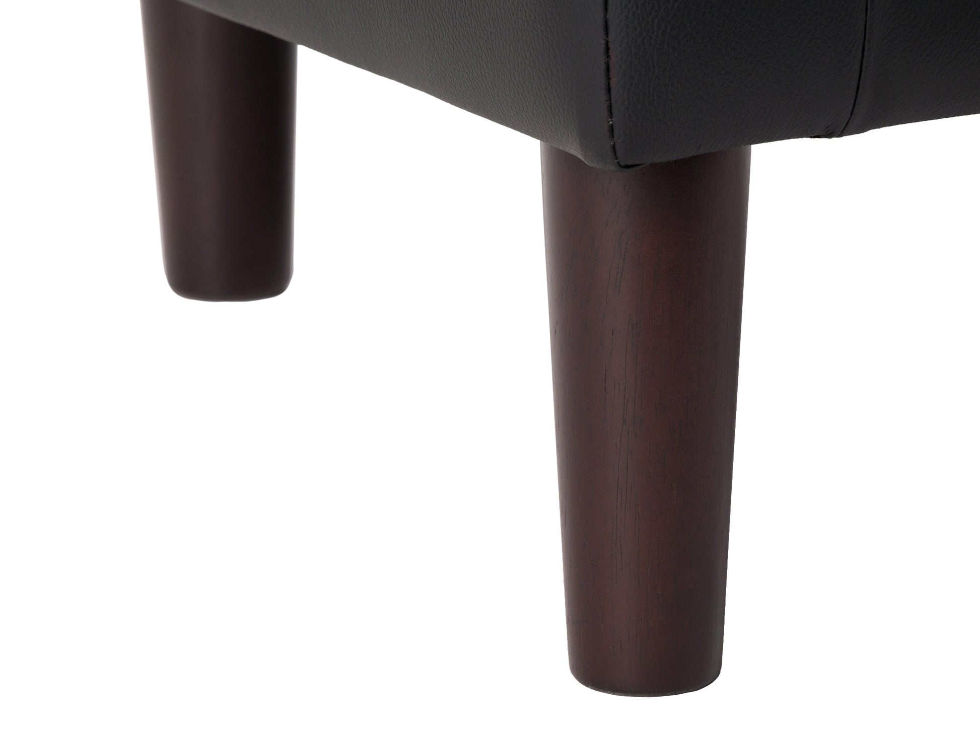 Black vegan leather barrel chair with curved back, plush cushioning, and sleek modern design. Perfect for living rooms or offices.