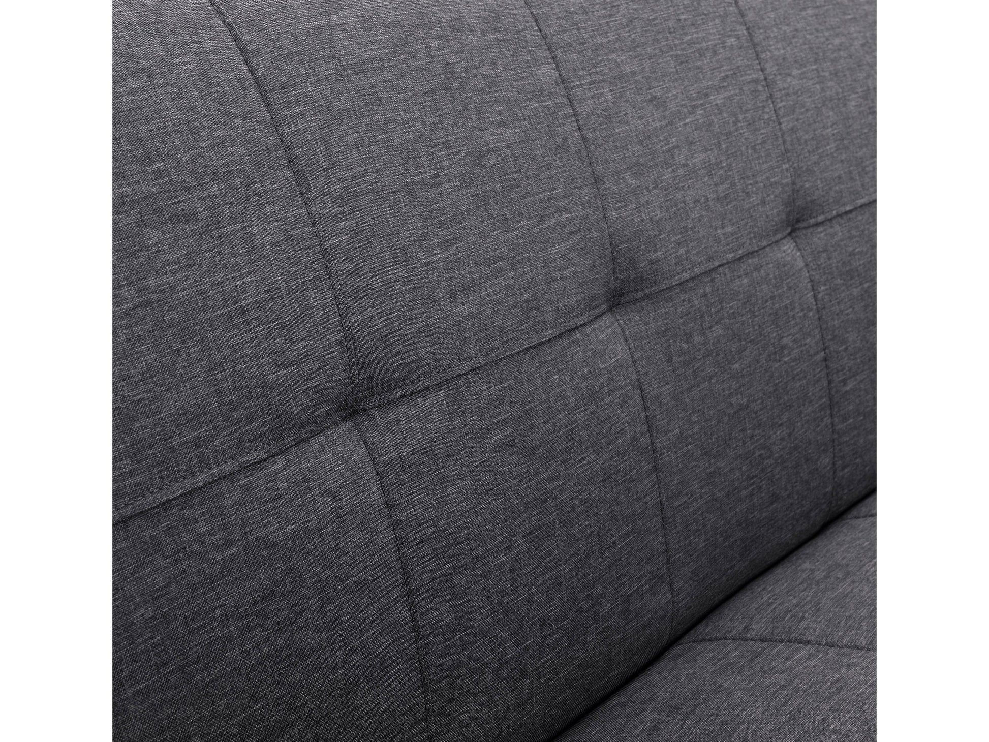 Dark grey futon sofa bed with tufted cushions, wooden legs, and versatile modern design.