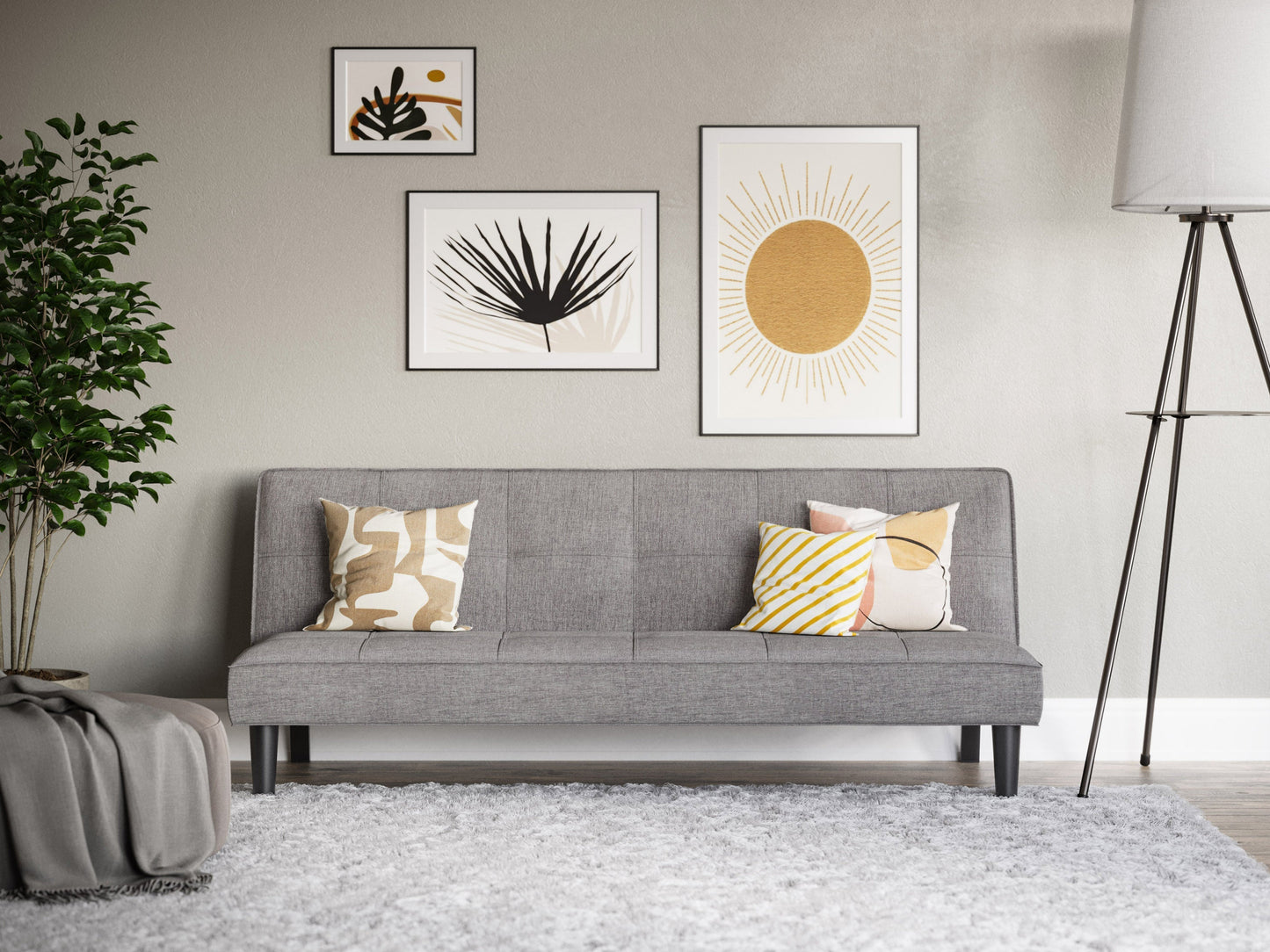 Light grey futon sofa bed with tufted cushions, wooden legs, and a foldable minimalist design.