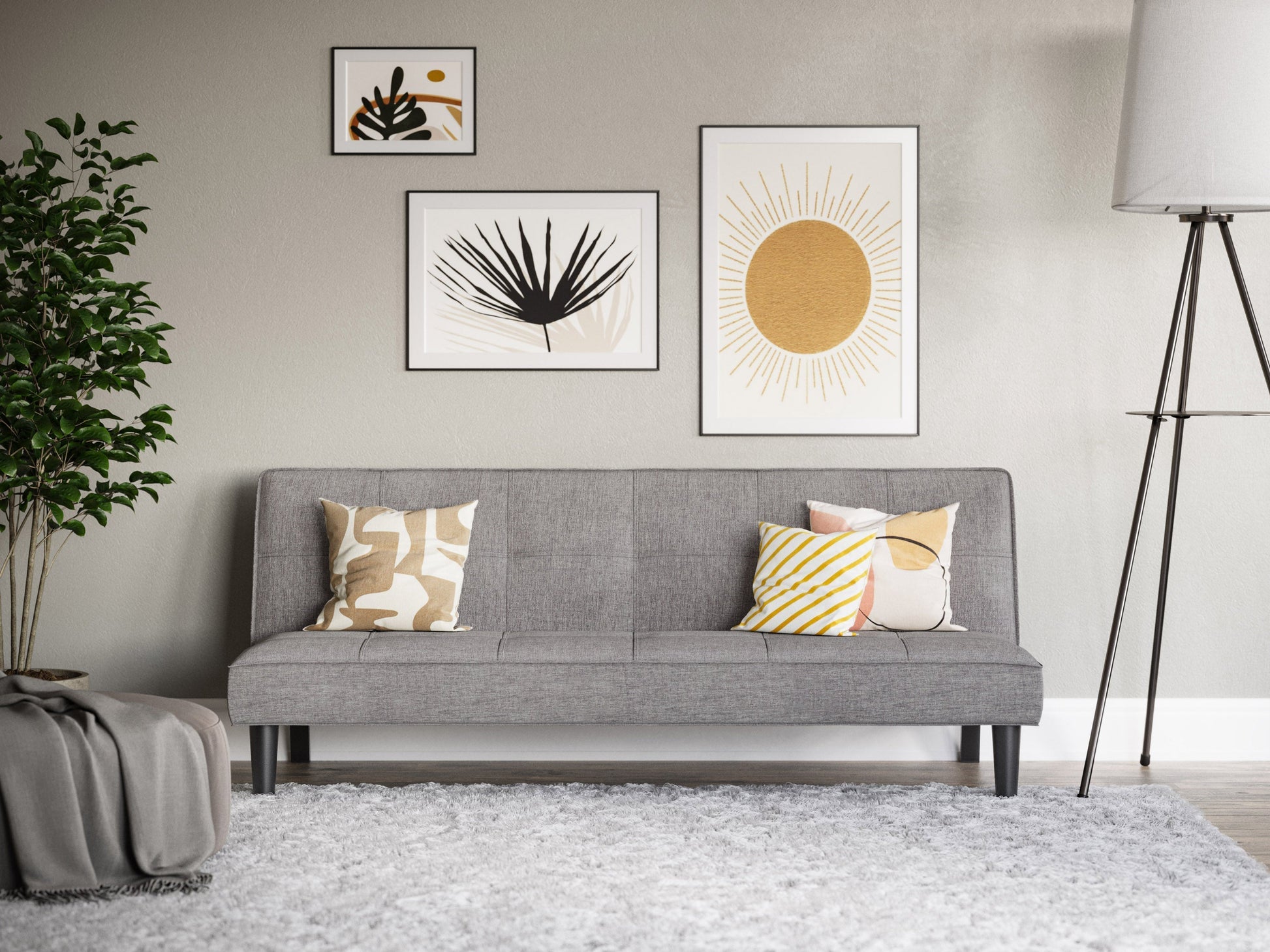 Light grey futon sofa bed with tufted cushions, wooden legs, and a foldable minimalist design.