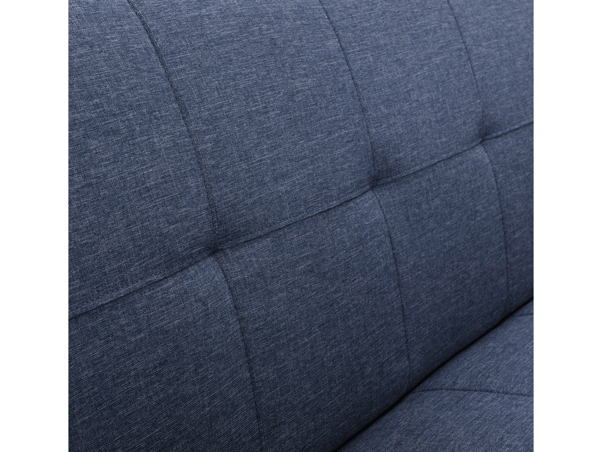 Blue futon sofa bed with tufted cushions, wooden legs, and convertible design for modern living rooms.