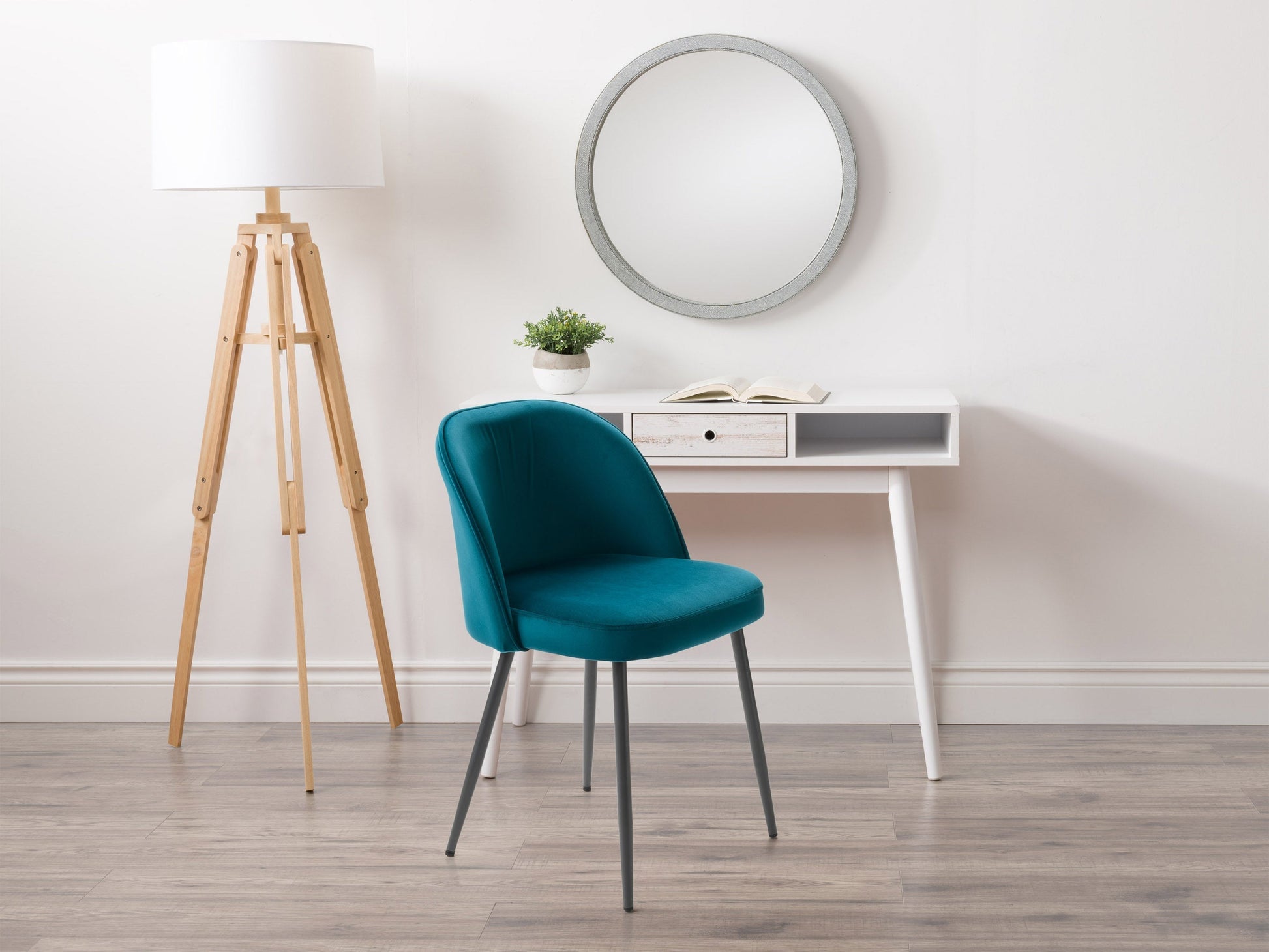Teal velvet dining chair with gold metal legs and tufted backrest, elegant and comfortable design.