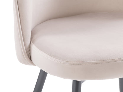 Beige velvet dining chair with curved backrest, gold metal legs, and plush upholstery.