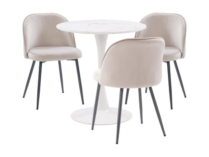 A white round table with three beige chairs around it.