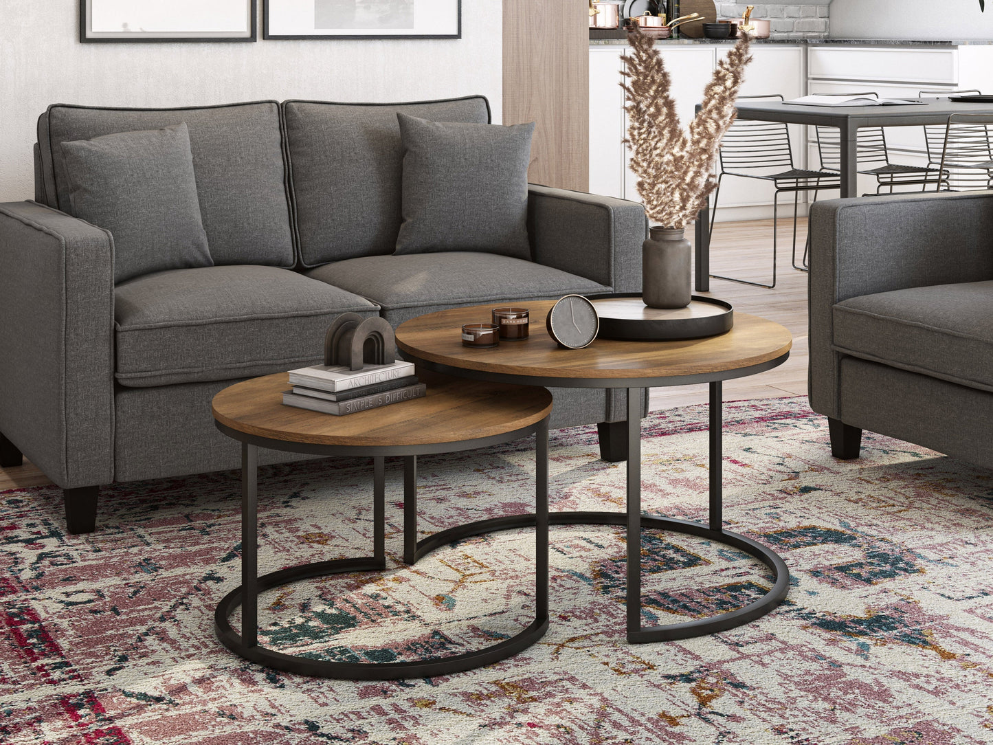 Round nesting coffee tables in brown wood with metal legs, modern design, versatile living room furniture.