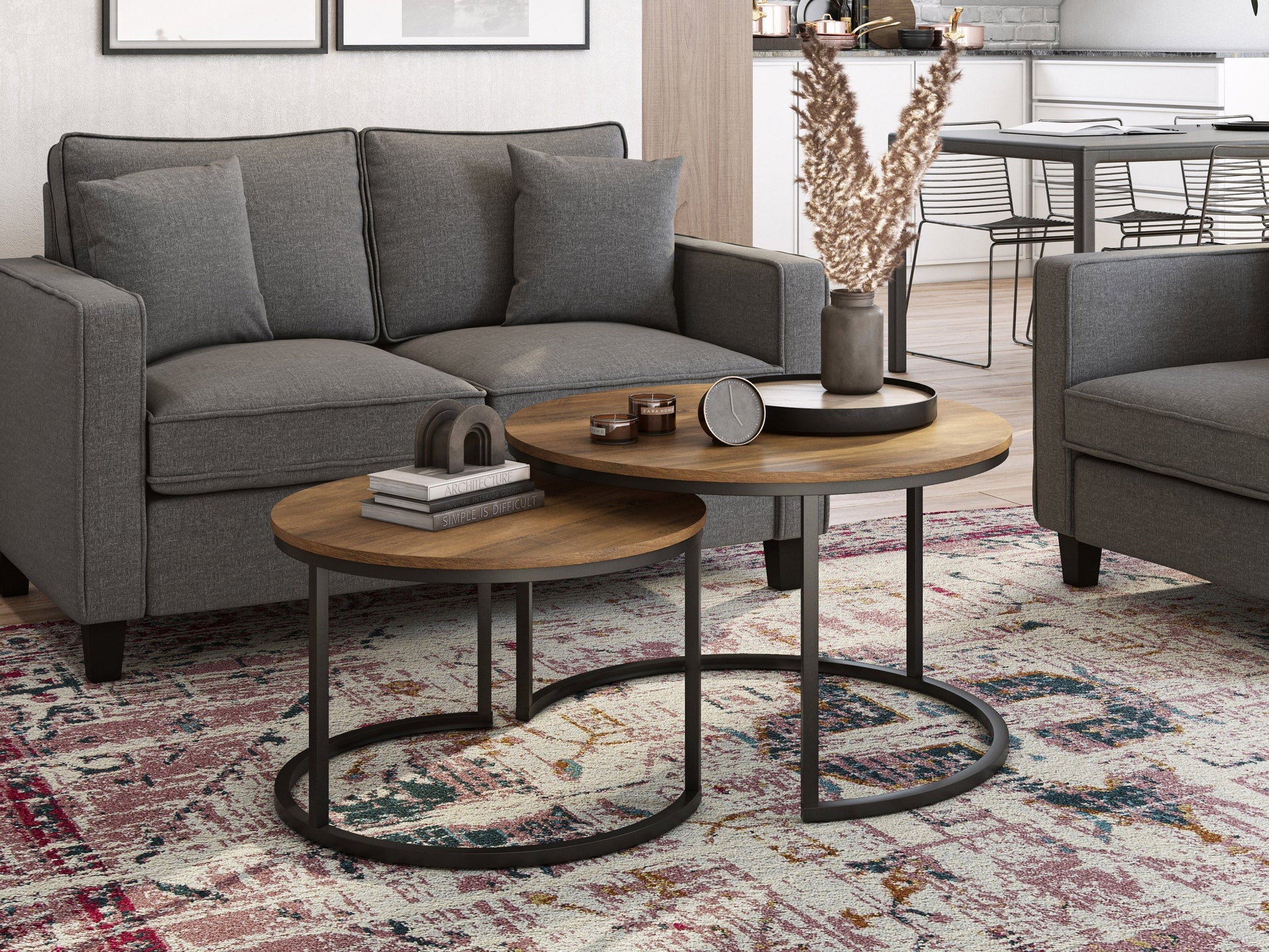 Round nesting coffee tables in brown wood with metal legs, modern design, versatile living room furniture.