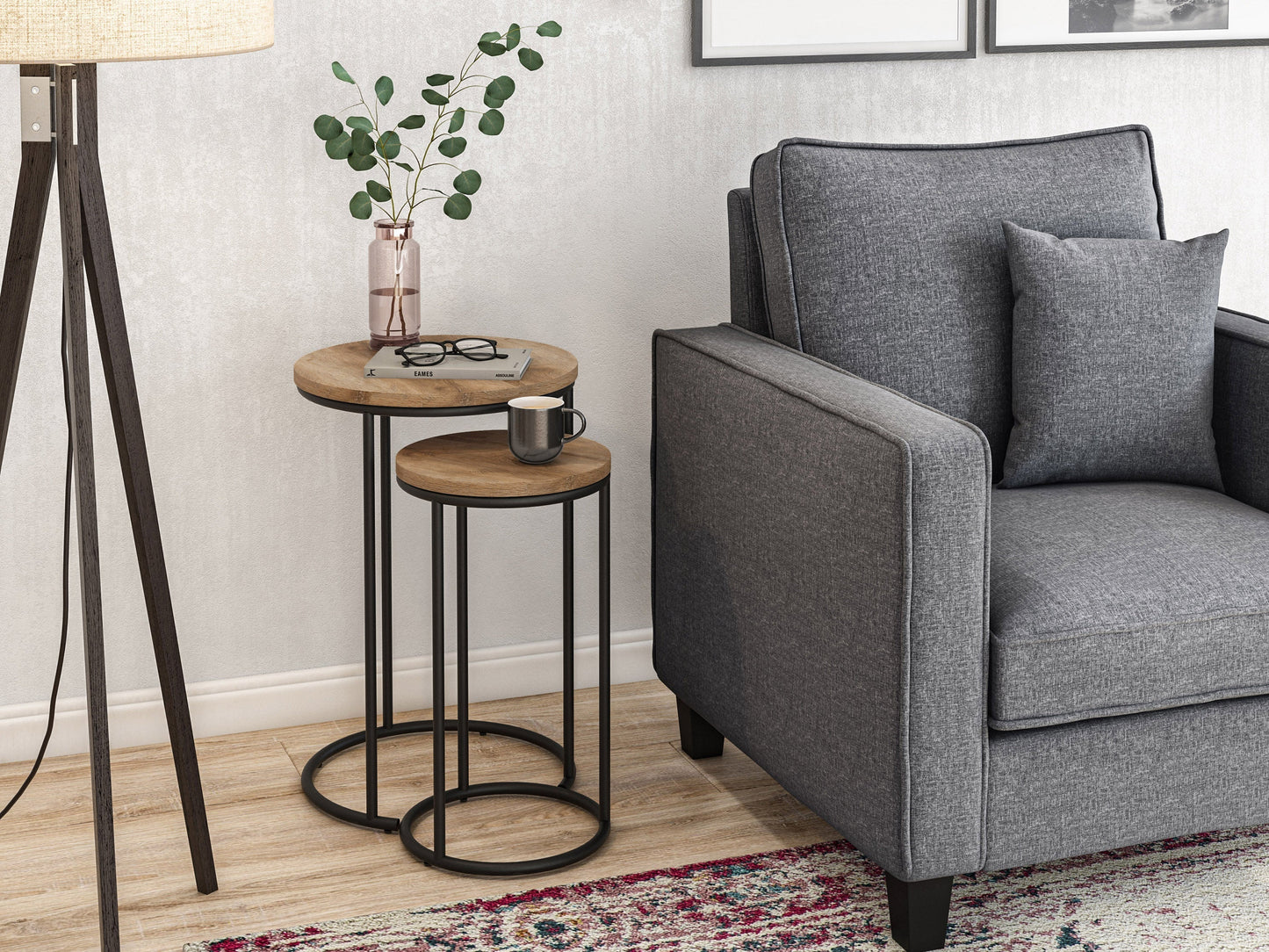 Light wood round nesting side tables with metal legs, minimalist design, and smooth finish.