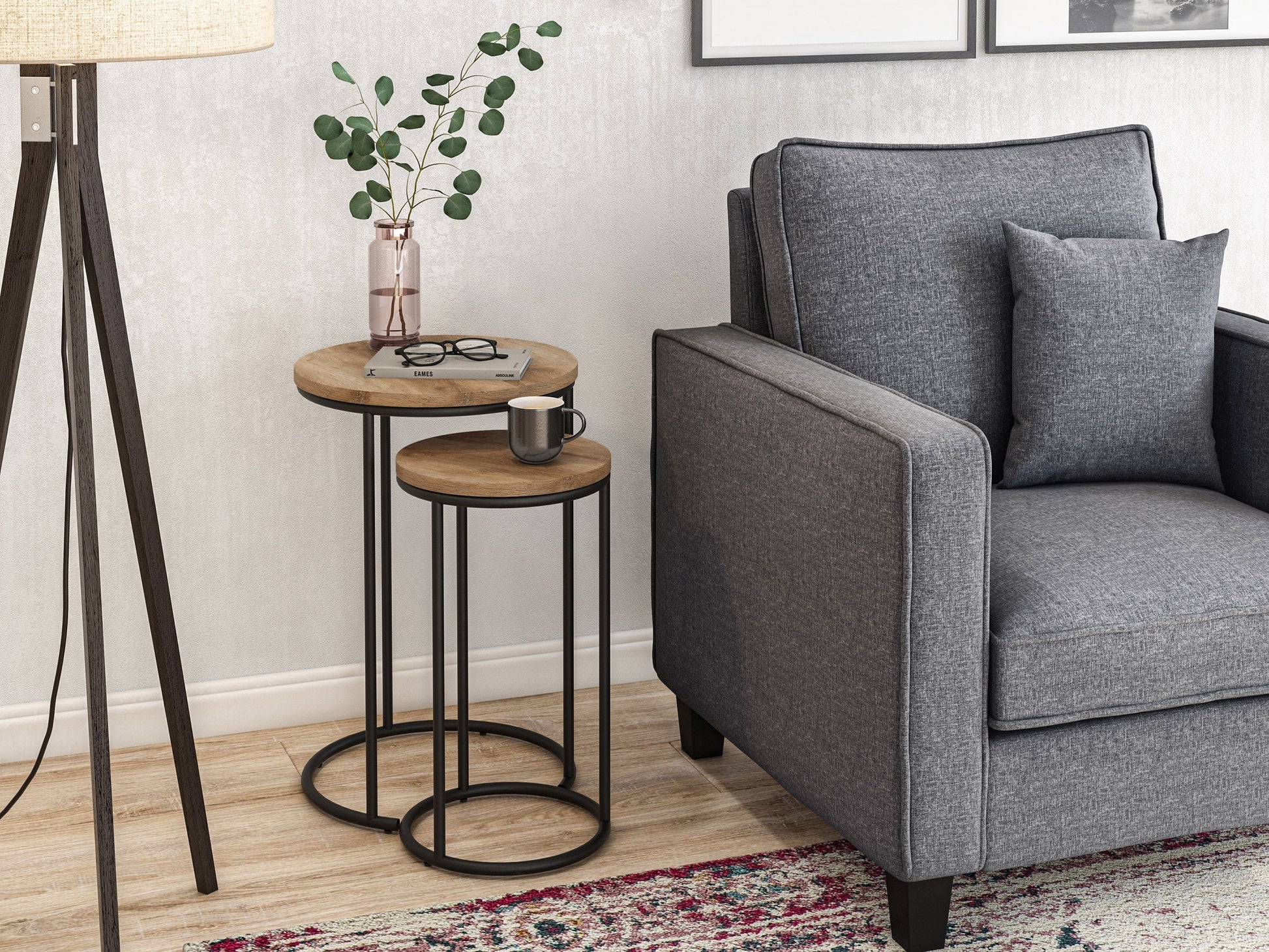 Light wood round nesting side tables with metal legs, minimalist design, and smooth finish.