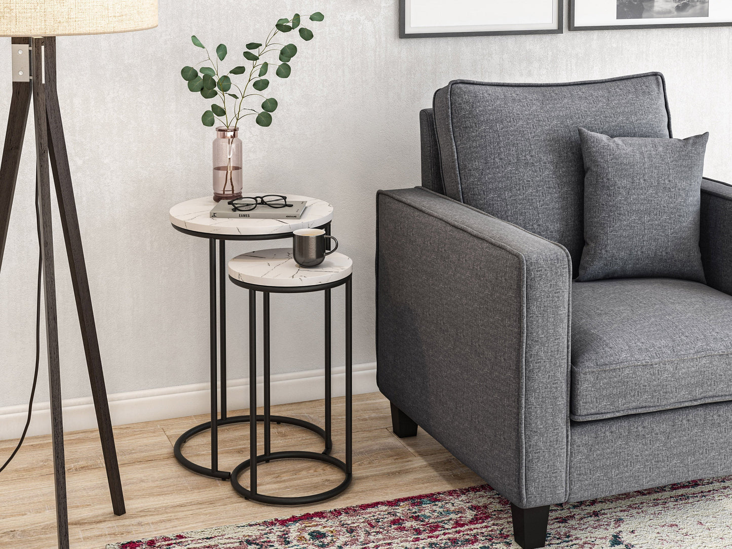 Round nesting side tables with white marble tops and gold metal frames, modern minimalist design.