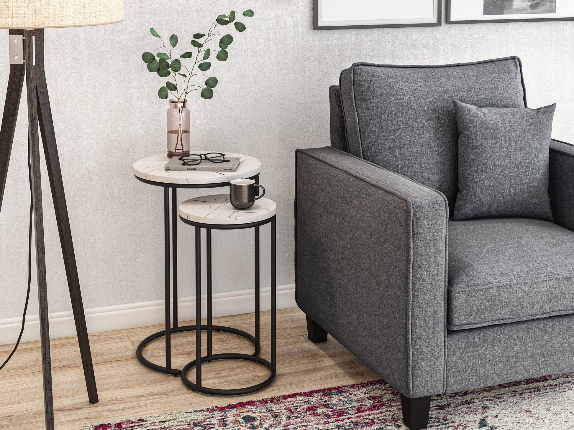 Round nesting side tables with white marble tops and gold metal frames, modern minimalist design.
