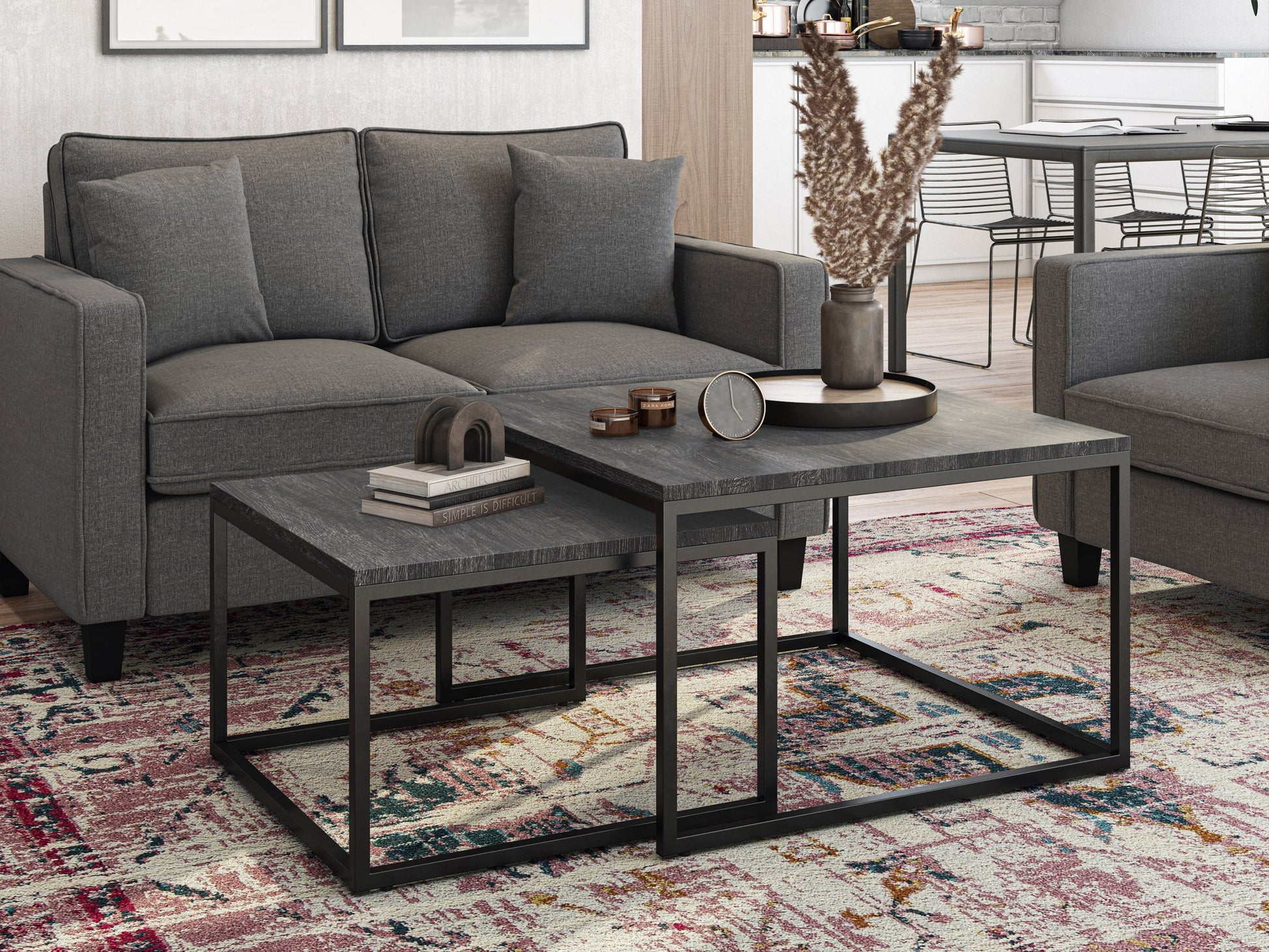Square nesting coffee tables with grey wood tops and black metal frames, modern design, space-saving furniture.