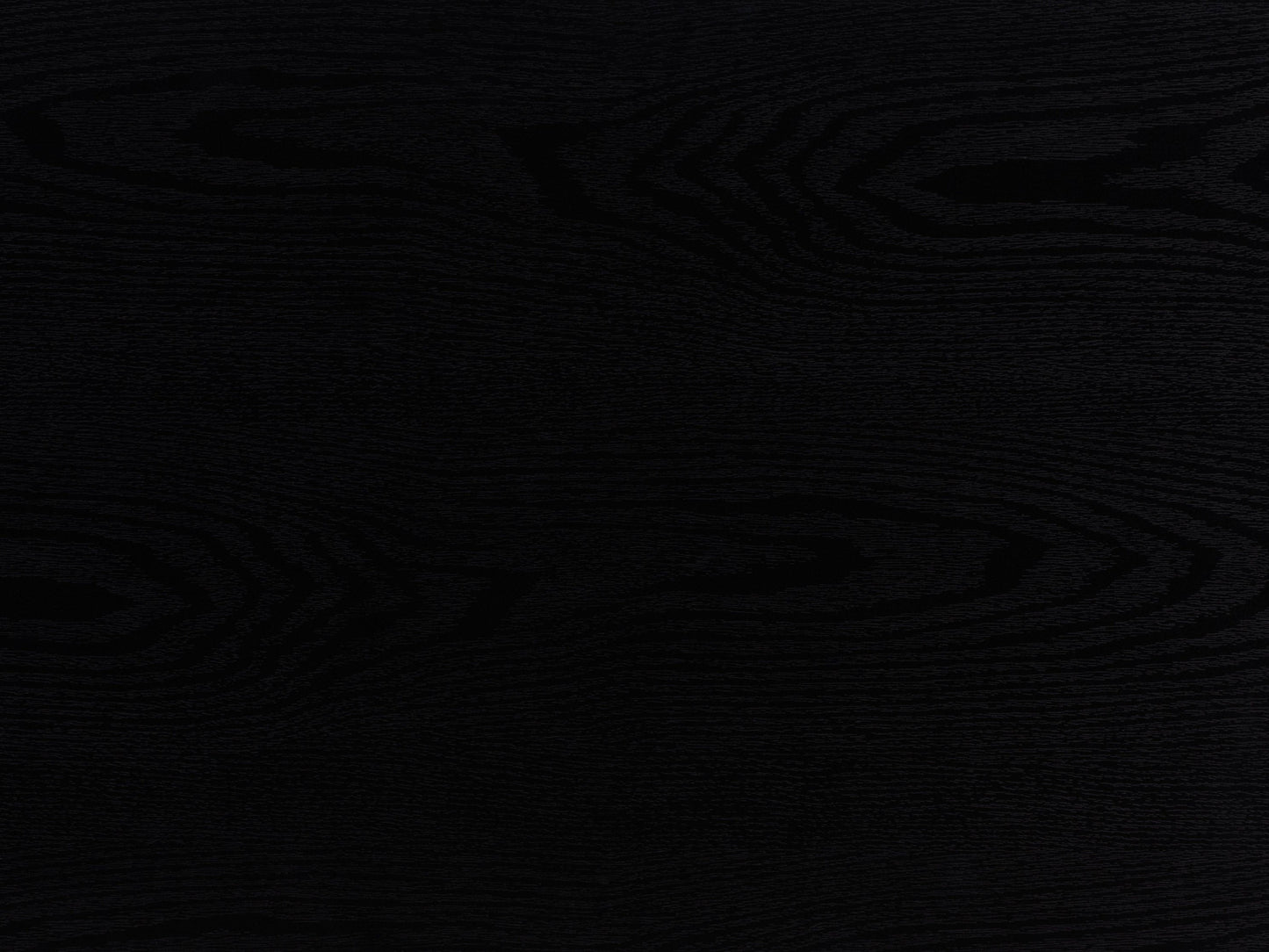 Black fluted side table with sleek round design, textured surface, and sturdy metal legs.