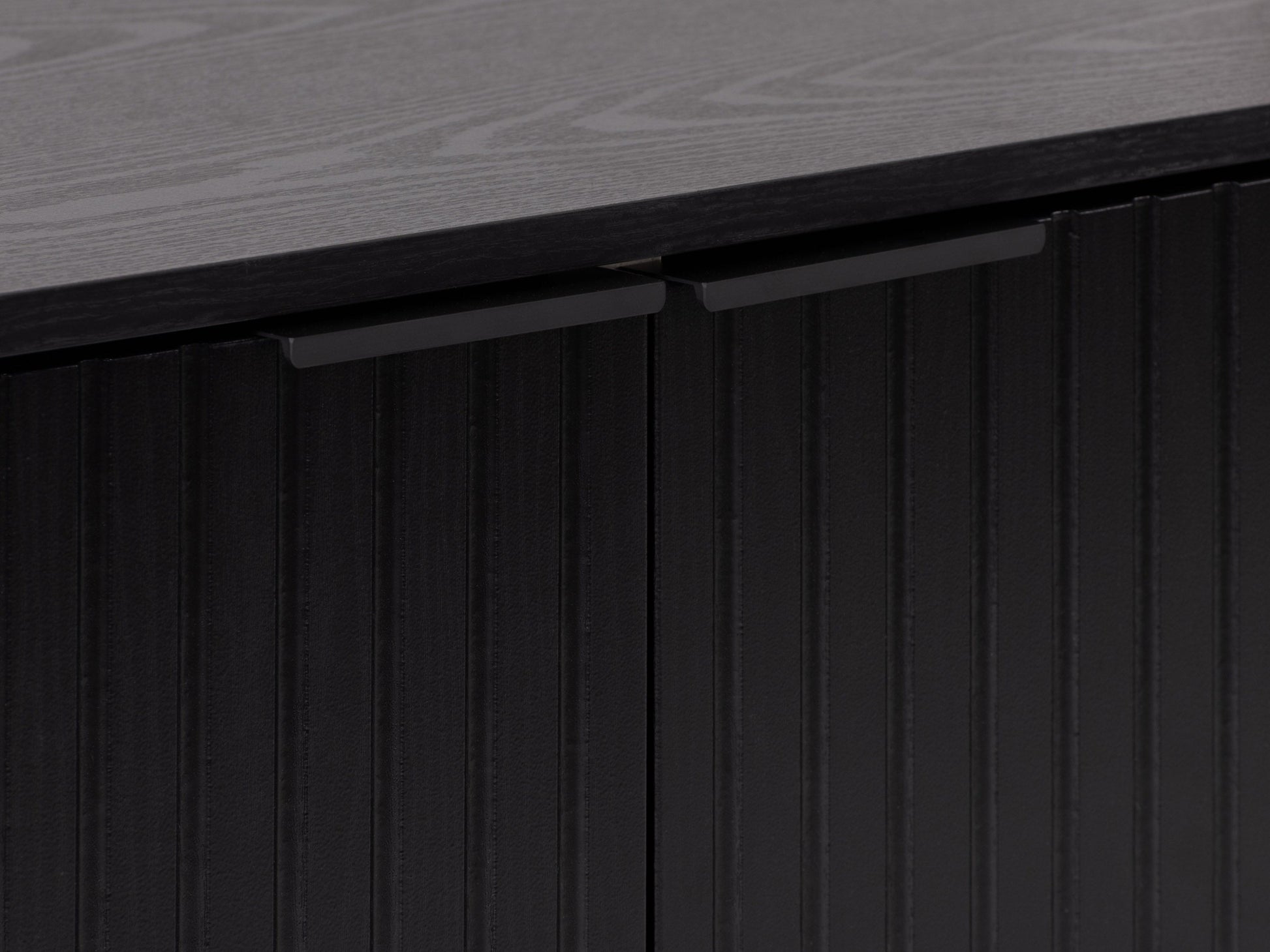 Black fluted TV stand with sleek design, open shelving, and gold accents.