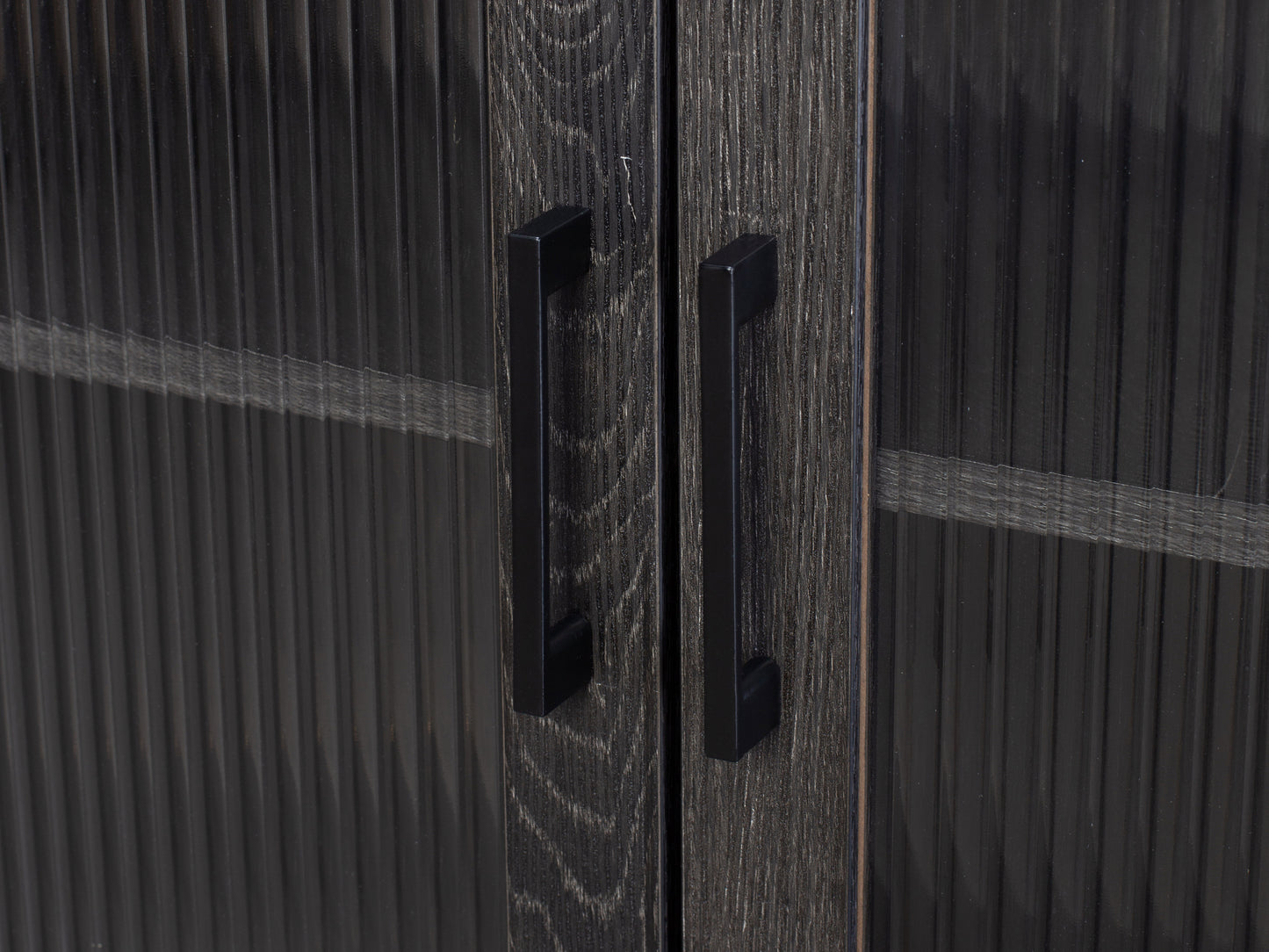 Fluted glass sideboard with black metal frame, featuring ribbed glass doors, sleek handles, and a modern design.
