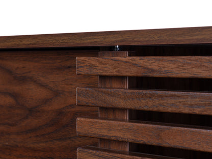 Walnut sideboard console TV stand with a sleek, modern design featuring a rich walnut finish, smooth surfaces, and minimalist metal handles. Ample storage space with closed cabinets and open shelving for media equipment.