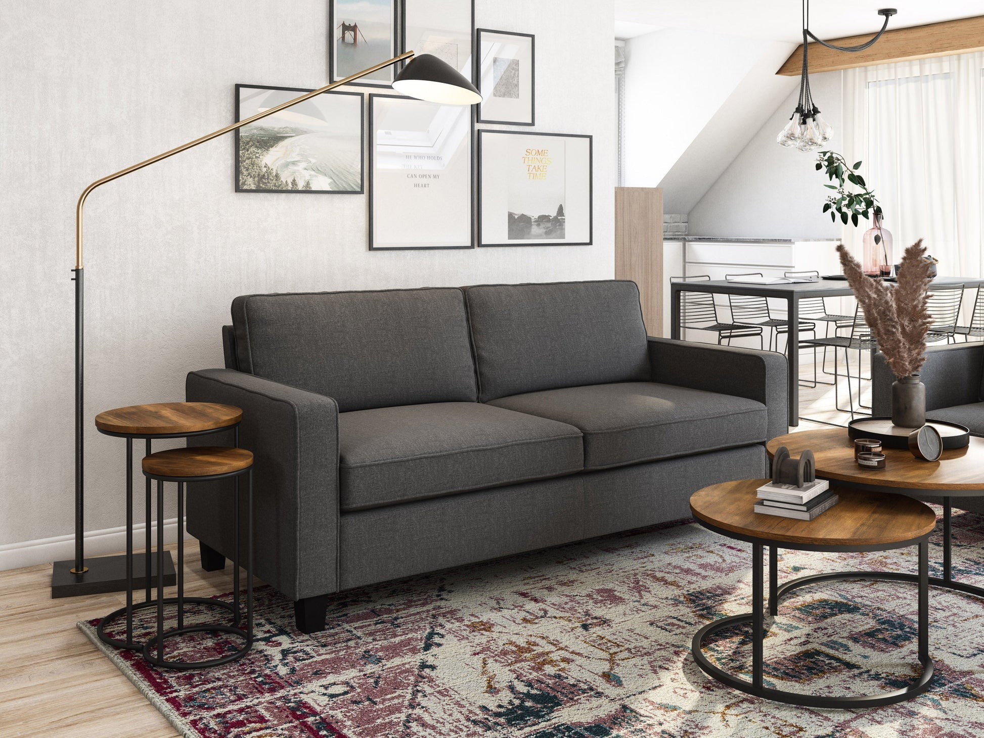 Grey 3-seater sofa with tufted cushions, wooden legs, and modern design for living room.