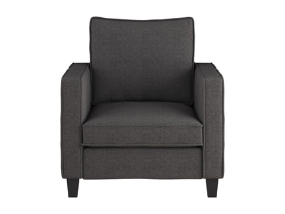 Grey fabric armchair with matching ottoman, wooden legs, and tufted cushions for a modern living room.