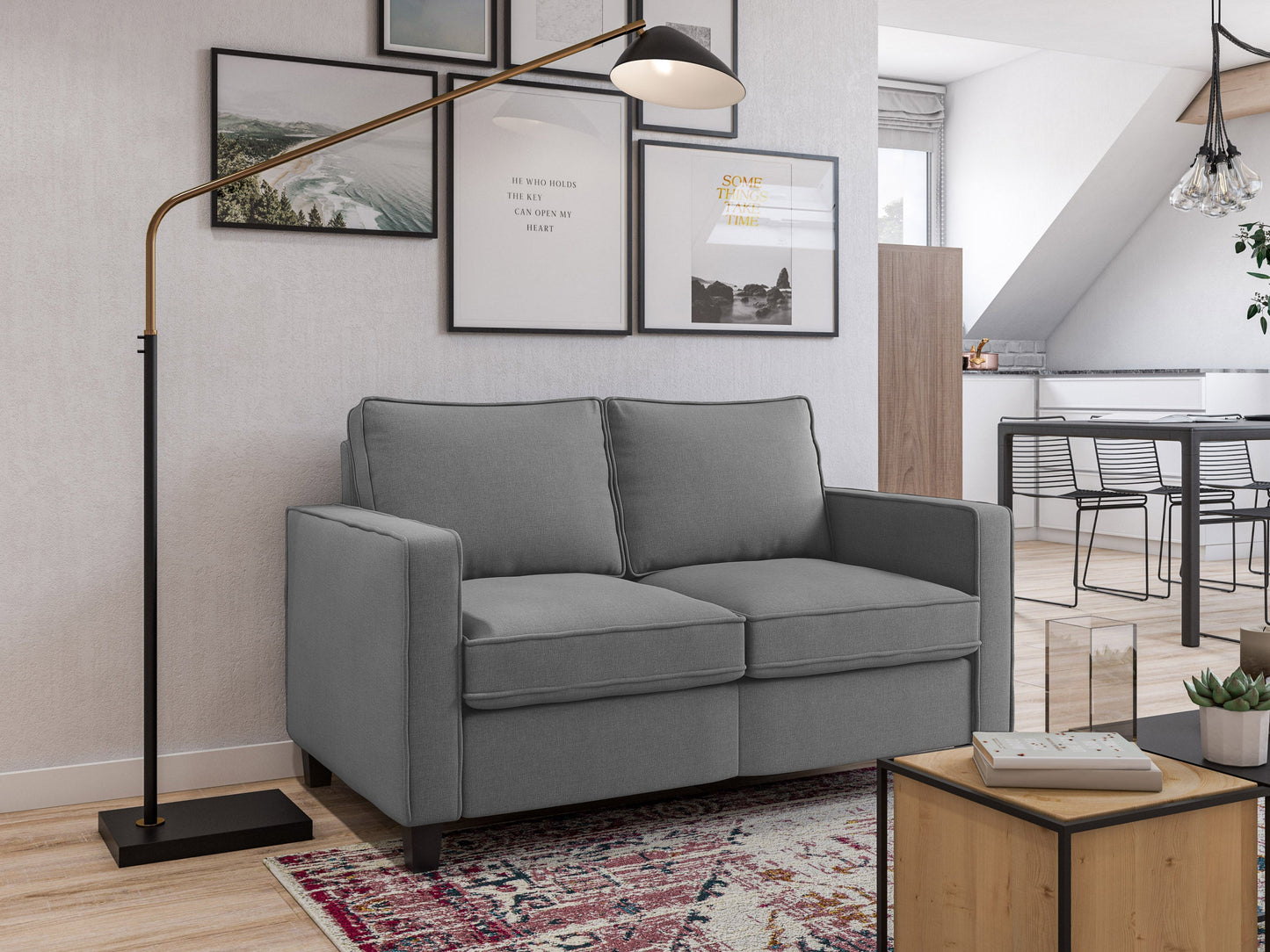 Grey 2 seater loveseat with tufted cushions, wooden legs, and modern minimalist design.
