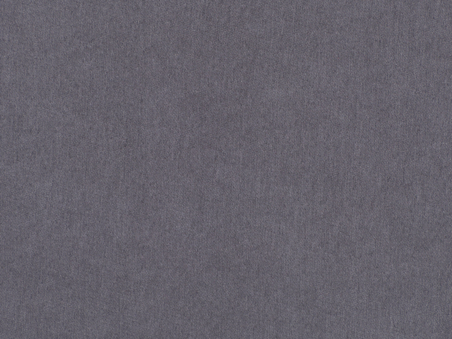 Grey accent chair with ottoman, tufted cushions, wooden legs, and modern minimalist design.