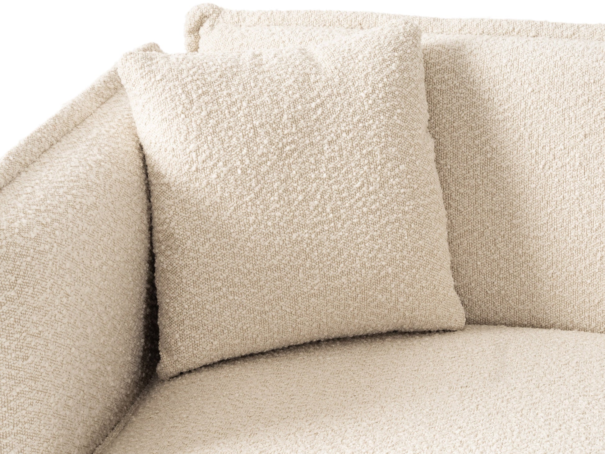 Cream boucle sofa with wooden legs, plush cushions, and modern design.