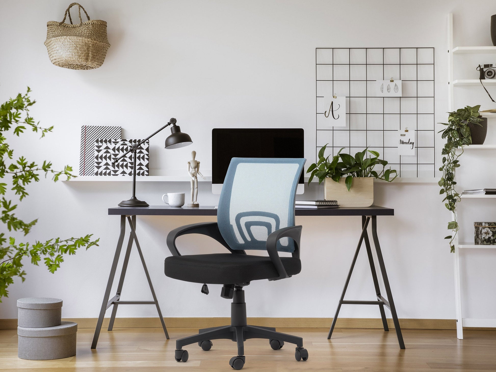 Blue mesh back office chair with adjustable armrests, ergonomic design, and swivel base for home or office use.