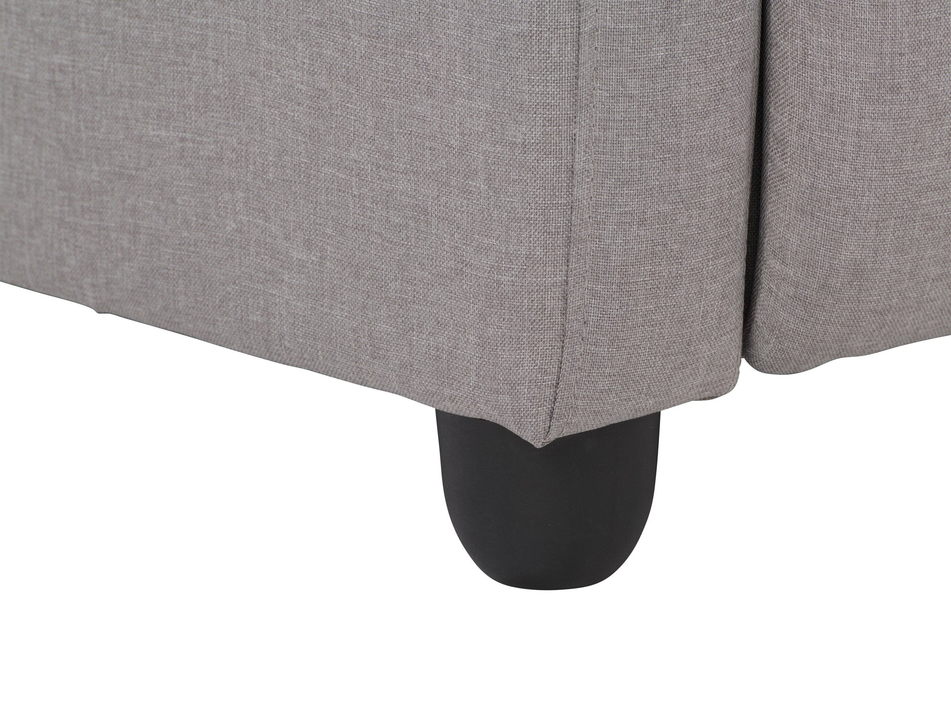 Light grey push back recliner with fabric upholstery, padded armrests, and wooden legs.