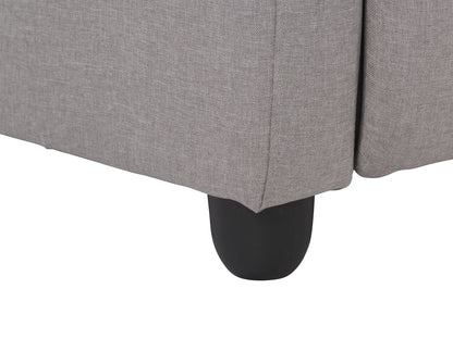 Light grey push back recliner with fabric upholstery, padded armrests, and wooden legs.