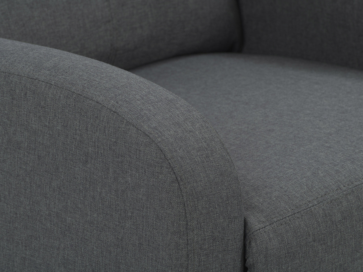 Dark grey push back recliner with plush cushions, wooden legs, and sleek modern design.